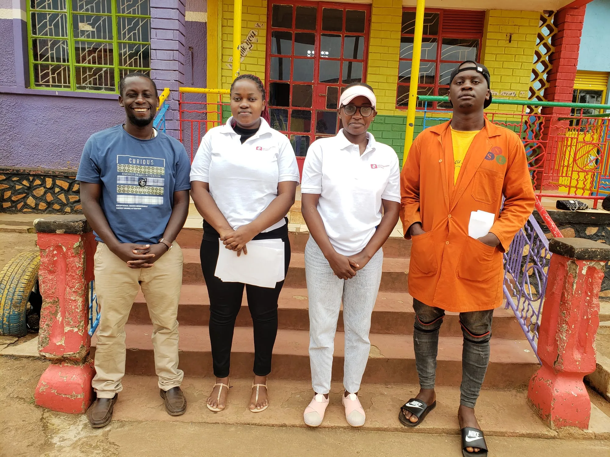 Obuyisi bw'Omu Initiative volunteers standing together in Bwaise
